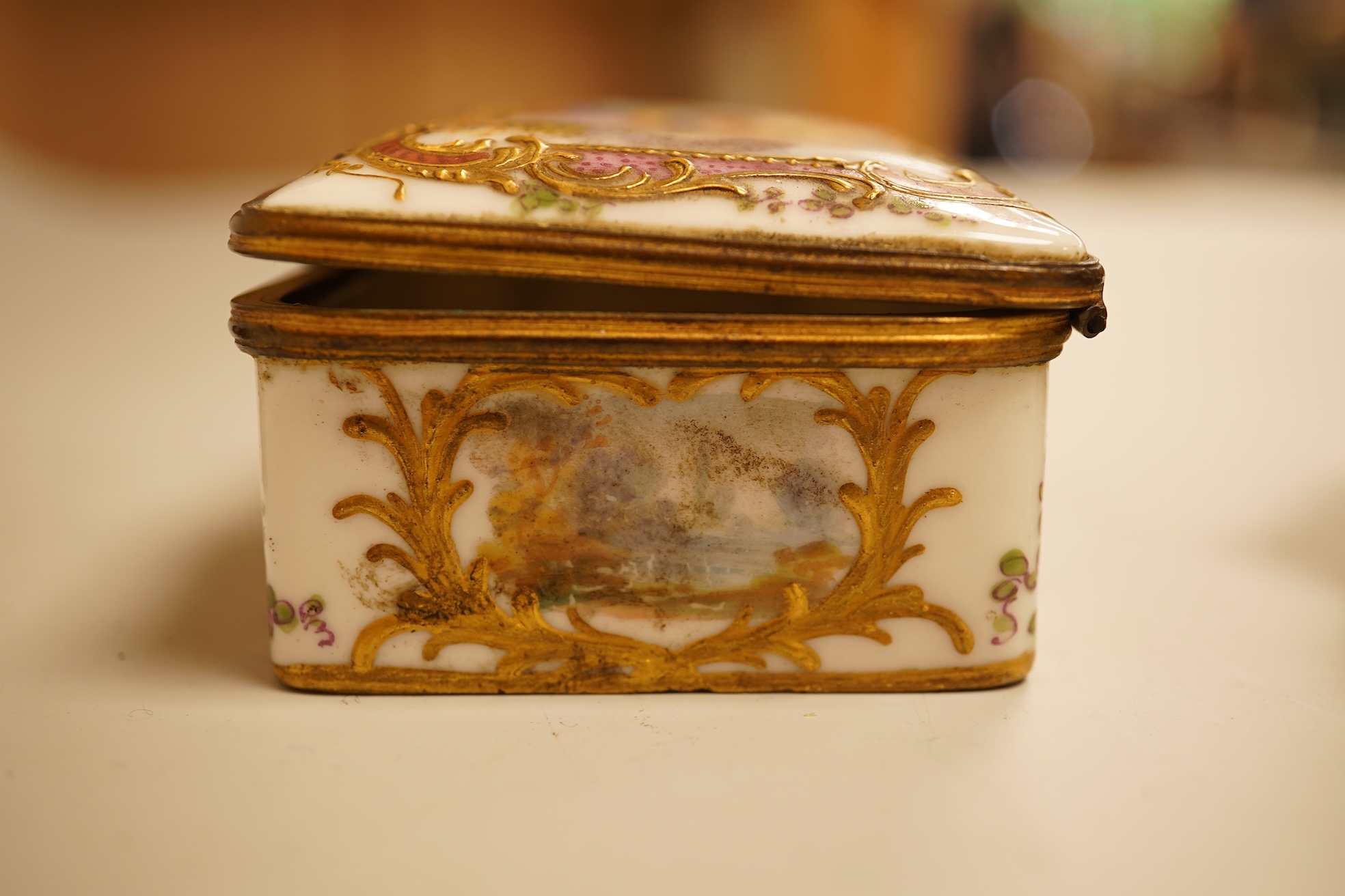 A Zsolnay lustre 'chicken' box and cover and two Sevres style porcelain boxes and covers (3) ‘chicken box’ 5cm diameter.